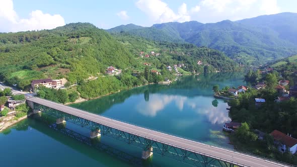 Aerial view of bridge over water without traffic alt