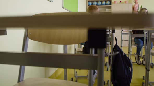 Tracking video of students writing during a pandemic. Shot with RED helium camera in 8K alt