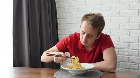 A Man Eats Vermicelli Fast Food Pasta