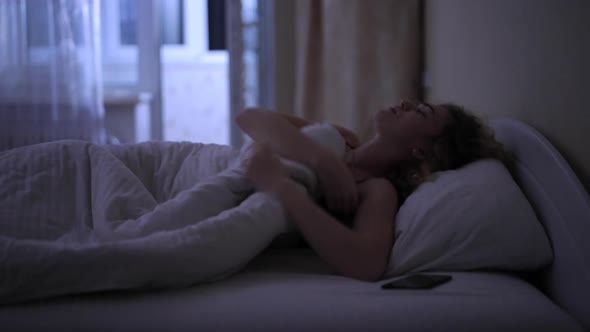 Woman with Insomnia in Bed