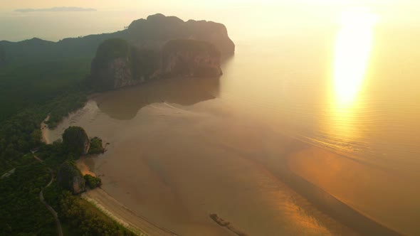 Aerial sunset above mountain silhouette. Beautiful views of the Andaman Sea alt
