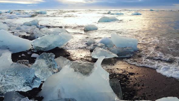 Icebergs on a Black Volcanic Beach Beautiful Nature Concept Closeup Aerial Top View Ice Winter alt