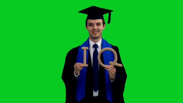 Smart Graduating Student Showing Letters of IQ Symbol for Intelligence Quotient