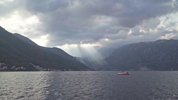 Sunset on the Bay of Kotor. Light Through the Clouds