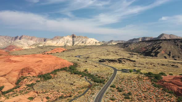 Asphalt Road In Snow canyon state park, St. George Utah, United States. Aerial Wide Shot alt