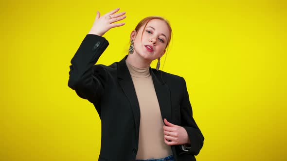 Confident Elegant Redhead Young Businesswoman Closing One Eye with Hand Looking at Camera alt