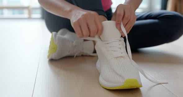 Woman wear sport shoes and prepare for running alt