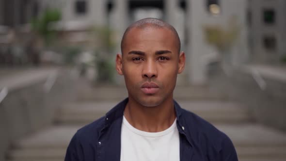 Serious Ethnic Man on City Street alt