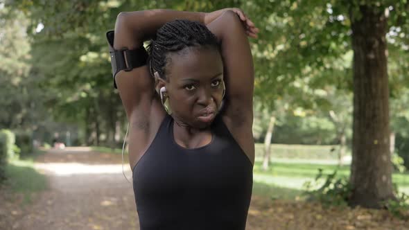 attractive young african athlete doing stretching- sport,health,run alt