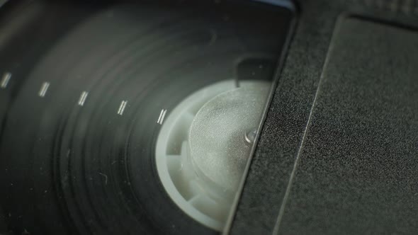 Rotation of the Film Reel of the Cassette Tape on the Right Side of the Video Cassette alt