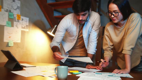 Two Creative Businesspeople meeting and Brainstorming ideas about new startup projects,