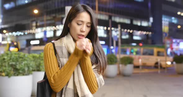 Woman feeling cold at outdoor alt