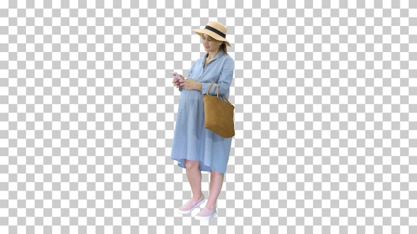 Pregnant woman on the 9th month using a smartphone, Alpha Channel alt