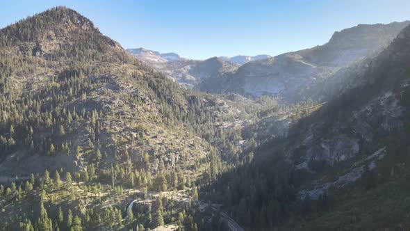 Drone flying over emerald bay towards Eagle Falls and Desolation Wilderness  During golden hour Taho alt