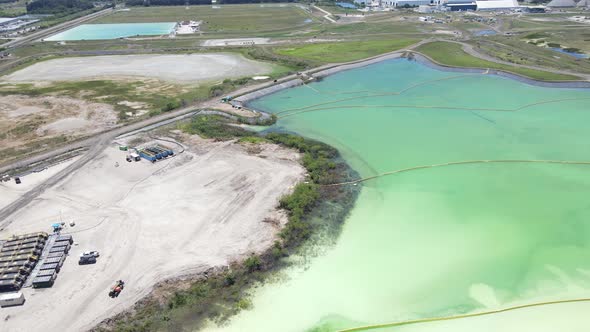 orbiting aerial of a large phosphate pool in Piney Point, Florida (Palmetto) alt