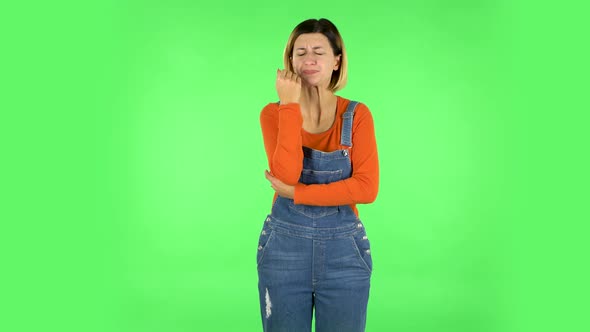 Girl Got a Cold, Sore Throat and Head, Cough on Green Screen at Studio alt