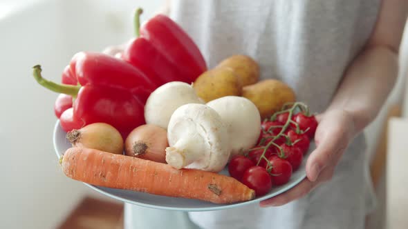 Woman Customer Shows Vegetables Tomatoes Carrots Bell Peppers Champignons and Potatoes