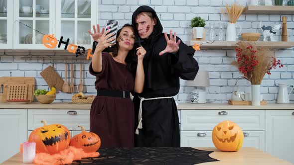 Young Couple Taking Selfie on Halloween Party alt