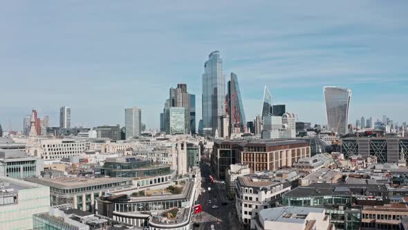 Slow drone shot towards Bank and city of London skyscrapers over queen Victoria street mansion house alt