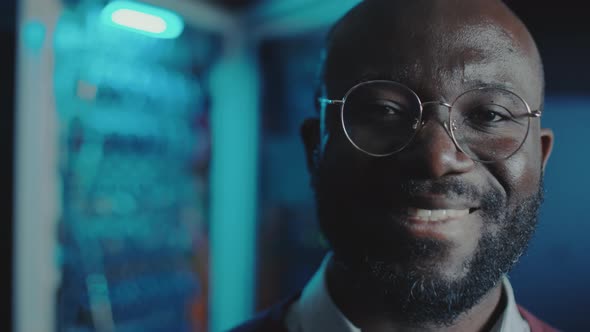 Portrait of Happy Data Center Engineer in Server Room alt