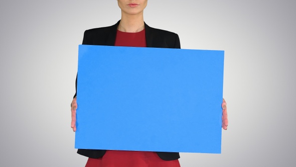 Businesswoman Holding Blank Whiteboard Sign on Gradient Background alt