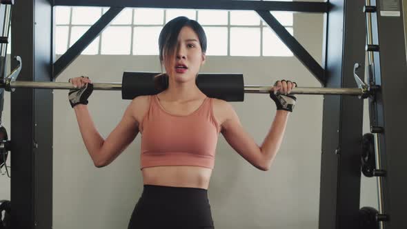 Asian young sport woman wear sportswear workout exercise with barbell at fitness or gym stadium club alt