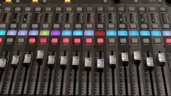 Remote control for adjusting the sound. Audio mixer. Sound engineer adjusts the sound.  alt