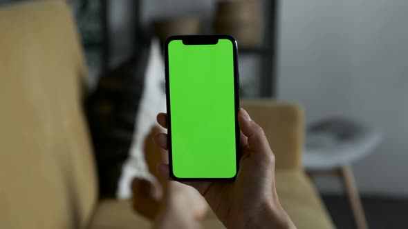 Point of View of Woman at Phone with Green Screen for Copy Space. Chromakey Lady Watching alt