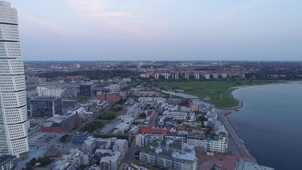 Drone shot of Malmö city at dusk