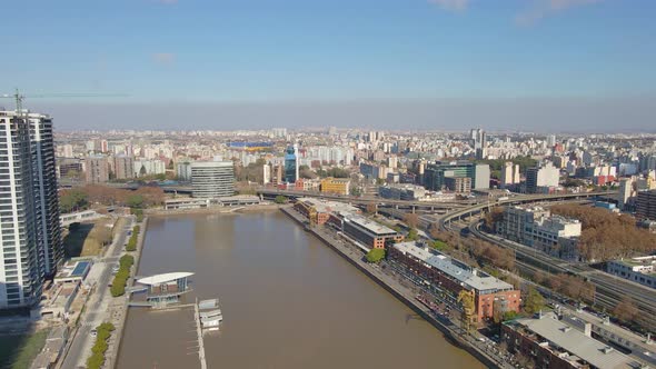 Aerial view of Buenos Aires city buildings with a freeway junction in the middle alt
