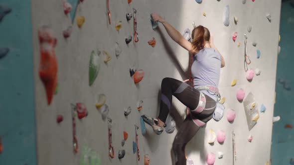 Female Professional Climber Practicing alt
