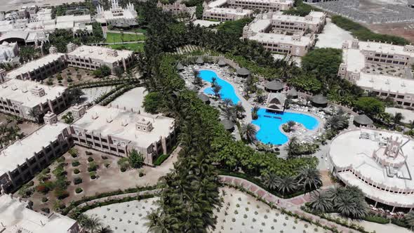 Aerial footage of the Hotel Riu Palace Cabo Verde Cape Verde showing the swimming pools and building