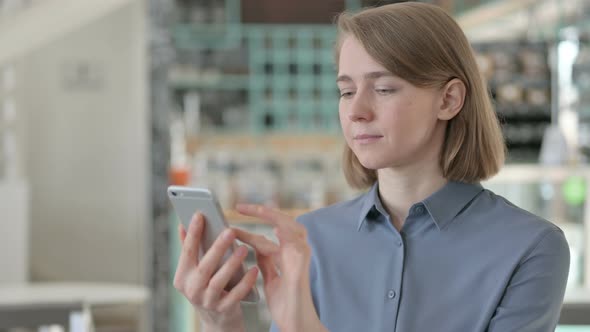 Portrait of Young Woman Using Smartphone alt