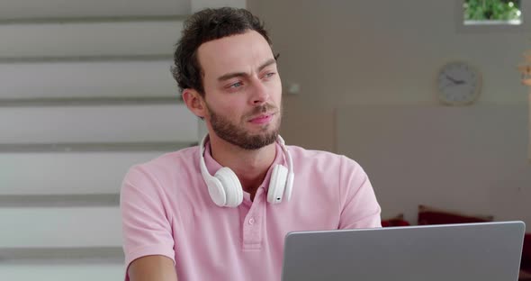 Closeup of Young Successful Entrepreneur Thoughtfully Looking Aside While Working on New Garndiose alt