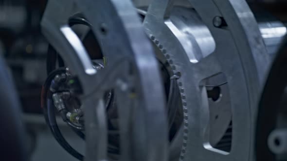 Closeup Robotic Tire Equipment Manufacturing Product Spinning in Factory alt