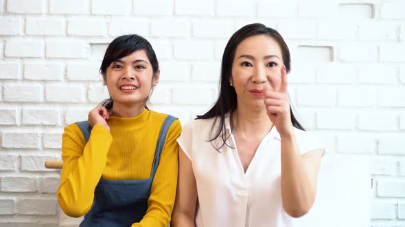 Excited Asian Females Watching TV alt