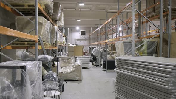 Stacks of Details Assembled Items at Corridor of Furniture Production Storage