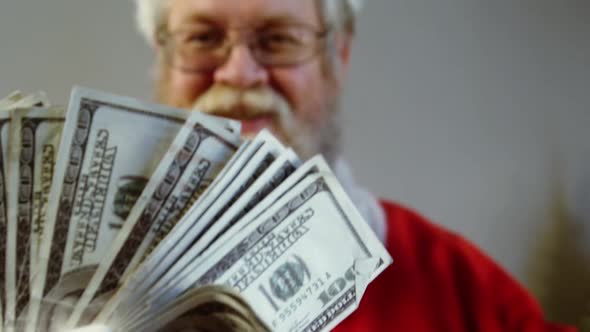 Santa claus fanning currency notes alt