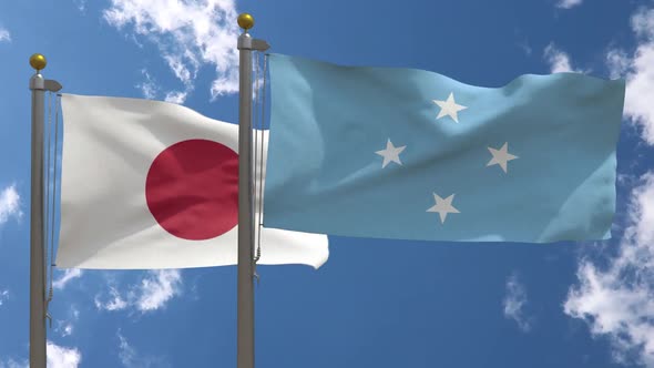Japan Flag Vs Federated States Of Micronesia Flag On Flagpole alt