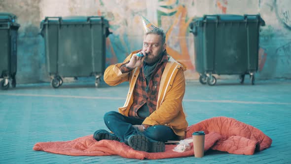 A Tramp with a Party Blower and a Birthday Hat alt