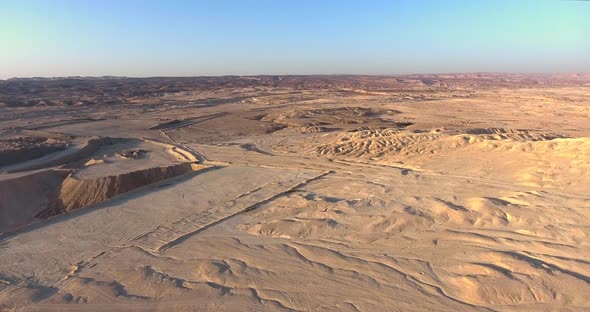Aerial footage at the desert viewing landscape changes because human interruption
