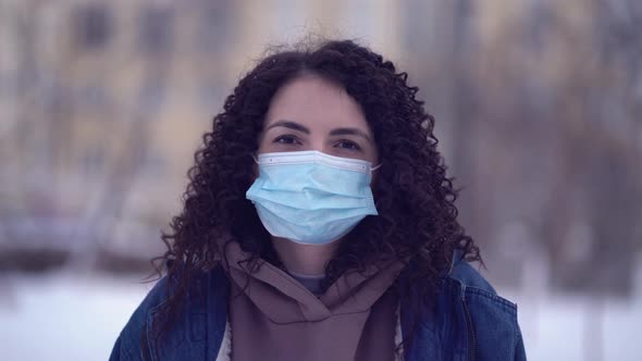 Pretty Woman in a City Wearing Face Mask Protective for Spreading of Disease Virus SARSCoV2