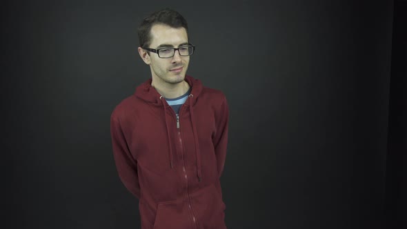 Professional Actor in Glasses Shakes Head in Negative Way alt