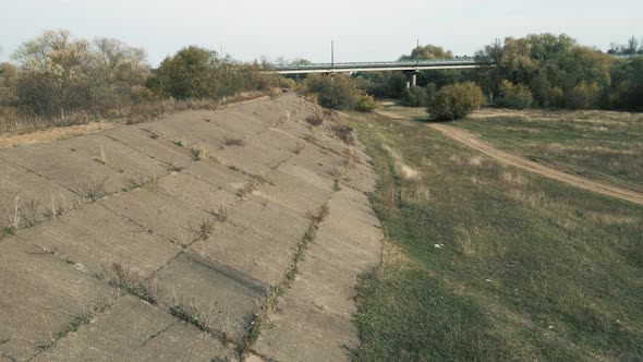 Closeup Birdseye View of the Old Dam Away From the Reservoir alt