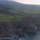 View of Bakio beach resort city and Gaztelugatxe, north rocky coast of Spain at sunset - VideoHive Item for Sale