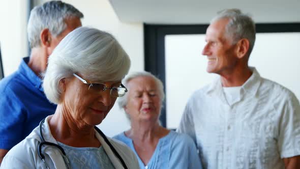 Doctor and seniors interacting with each other 4k alt