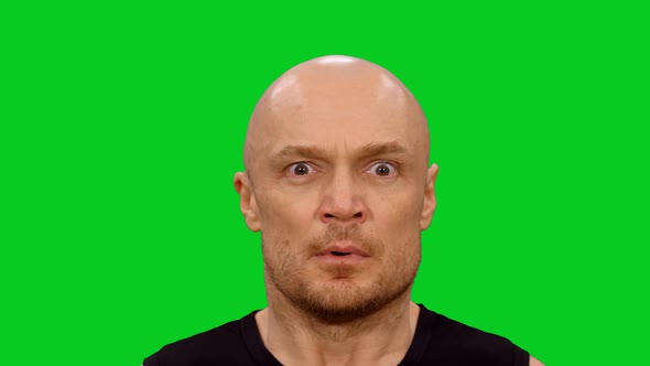 Frightened Man Expressing Emotions And Laughing In The End on Green Screen