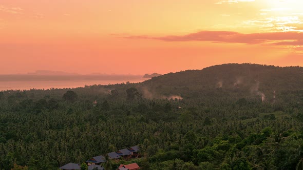 Aerial view of beautiful tropical island with palm at sunset time alt