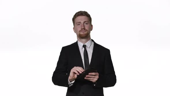 Businessman Takes Out a Wallet on a White Background Close-up alt
