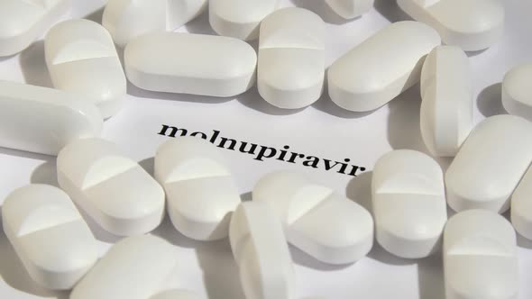 Closeup Shot of White Tablets on White Background alt